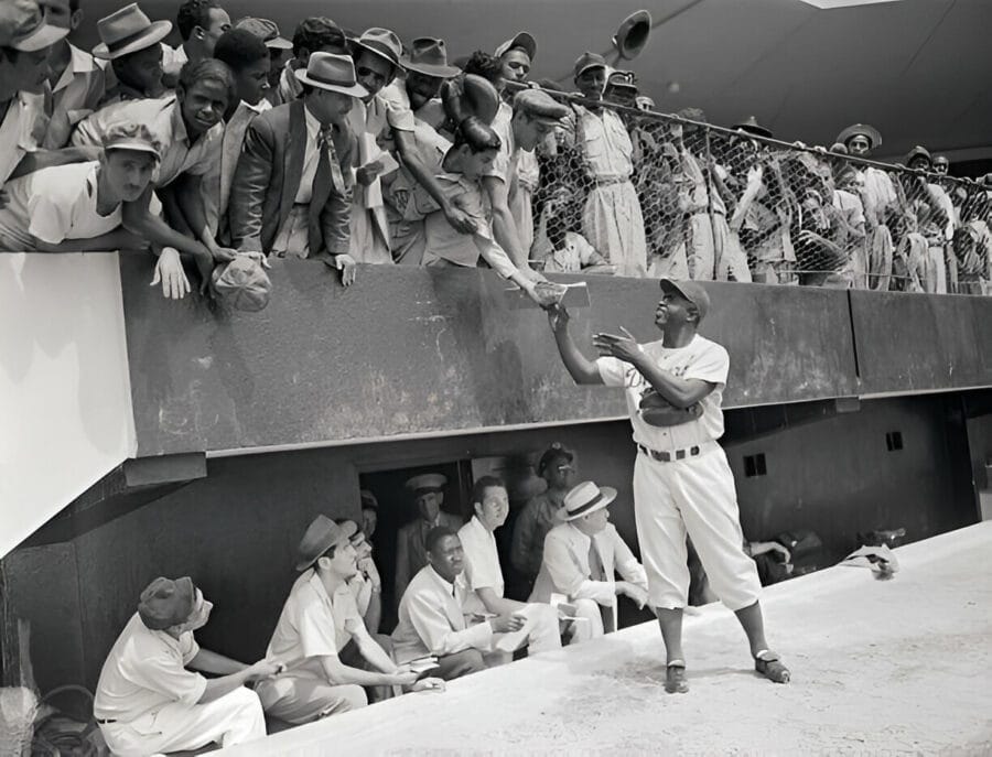 Jackie Robinson Signing Autographs from Field